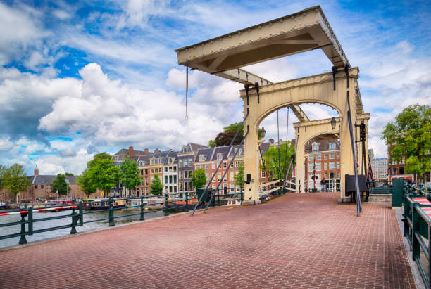 With its network of more than 100km of canals, it's no surprise that Amsterdam has become renowned as the City of Bridges. The Magere Brug is a bridge over the river Amstel in Amsterdam, Netherlands. It connects the banks of the river at Kerkstraat, between the Keizersgracht and Prinsengracht. The central section of the Magere Brug is a bascule bridge made of white-painted wood. The present bridge was built in 1934.