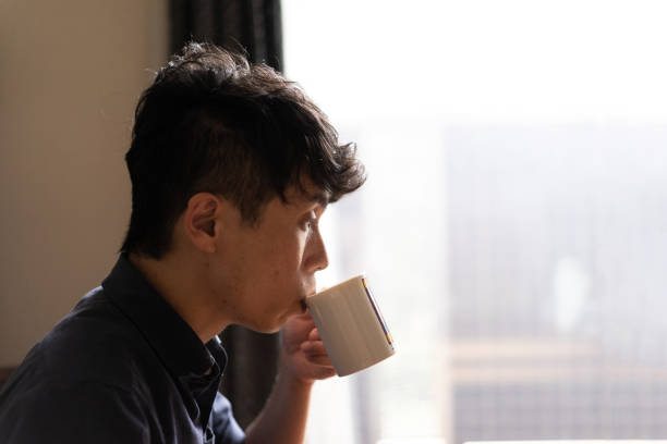 istock A man drinking coffee in living room at home 1276617700