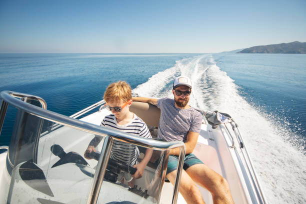 istock Father and son yachting 1276617903