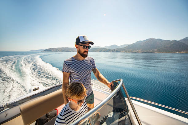 istock Father and son yachting 1276617929
