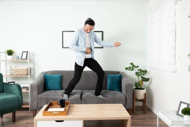 istock Latin man having fun at home 1276618267