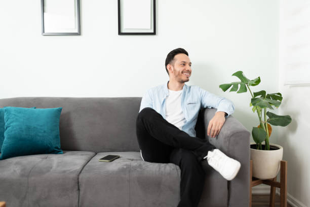istock Latin man sitting on a sofa 1276618828