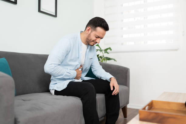 istock Guy in his 30s with a stomachache 1276618832