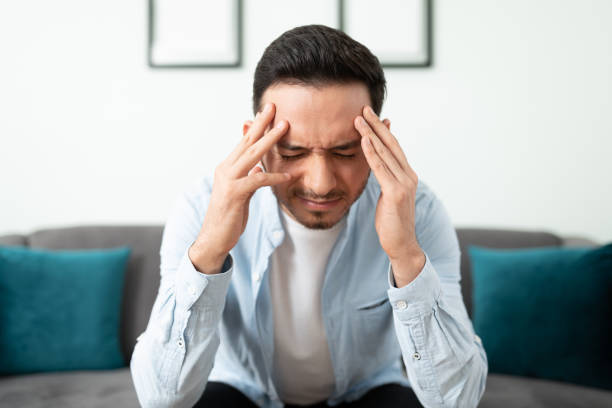 istock Stressed man suffering from migraine 1276618841