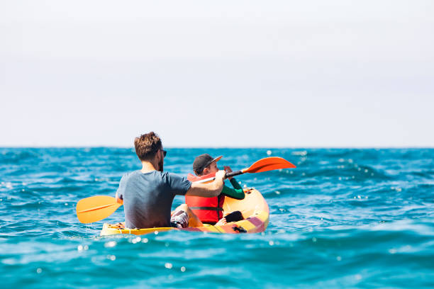 istock Father and son kayaking together 1276621655