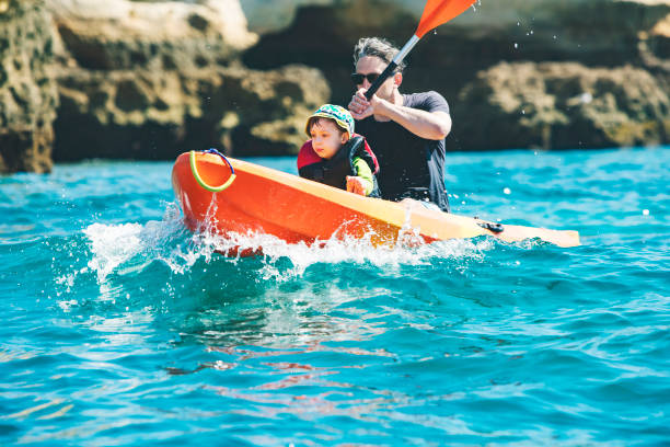 istock Father and son kayaking together 1276621661