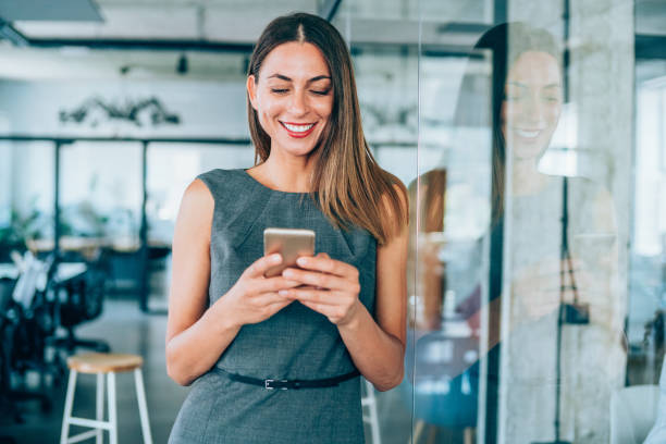 istock Businesswoman using smartphone in the office. 1276625030