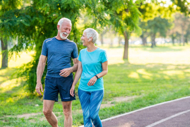 istock Senior couple jogging at the park 1276625118