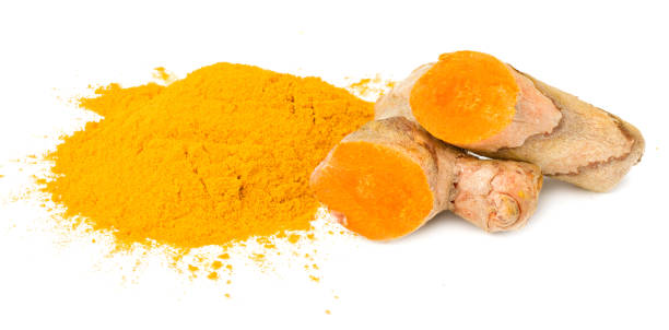 istock Turmeric powder with turmeric root isolated on white background 1276626923