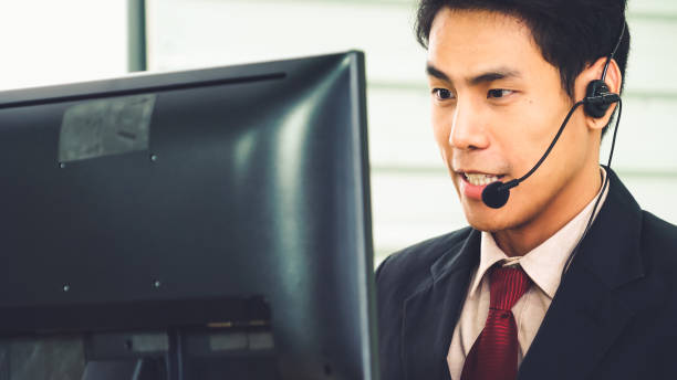 istock Business people wearing headset working in office 1276627043