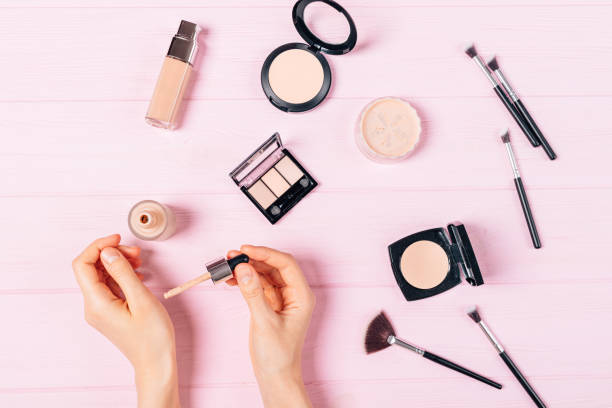 istock Flat lay woman's hands apply sample of foundation 1276628291