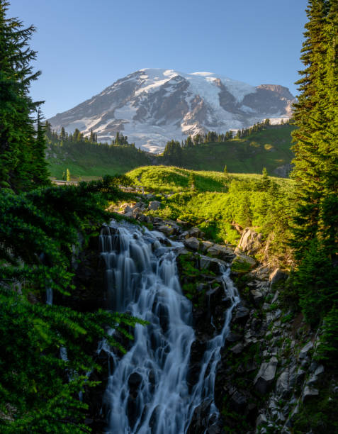 istock Myrtle Falls Cascades Over Cliff with Mount rainier 1276630255
