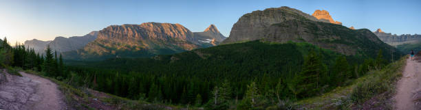 istock Panorama Of Morning Light Hitting Grinnell Point and Swiftcurrent 1276630317