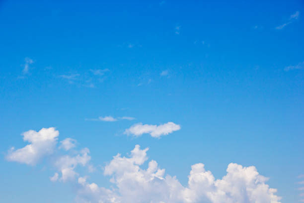 istock Blue sky background and white clouds soft focus, and copy space 1276630547