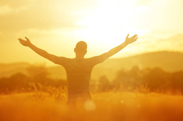 istock Man enjoying golden hour in the wheat crop 1276630561