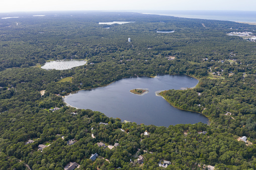 Freshwater lakes lie scattered throughout Cape Cod, Massachusetts. These shallow, scenic lakes were carved out of the peninsula's sandy soil as glaciers receded about 20,000 years ago.