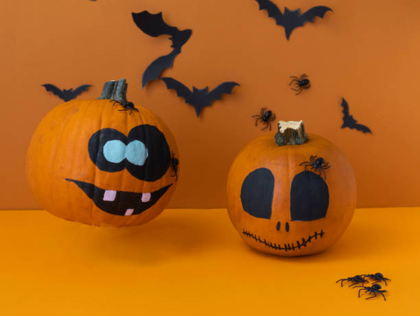 istock flying painted pumpkin on orange background 1276633866