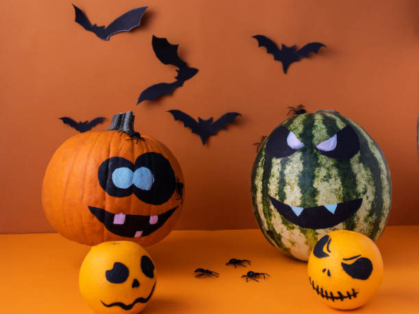 istock pumpkin oranges and watermelon with a scary expression 1276633875
