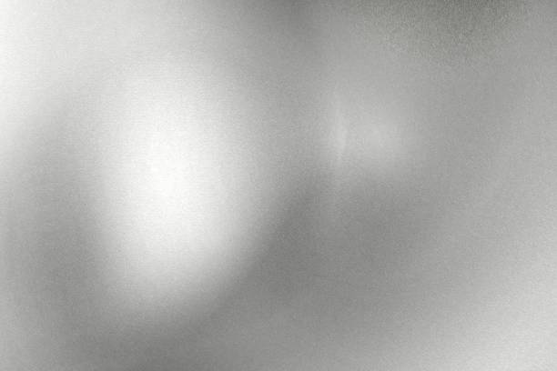 istock Glowing silver foil metal wall with copy space, abstract texture background 1276634460