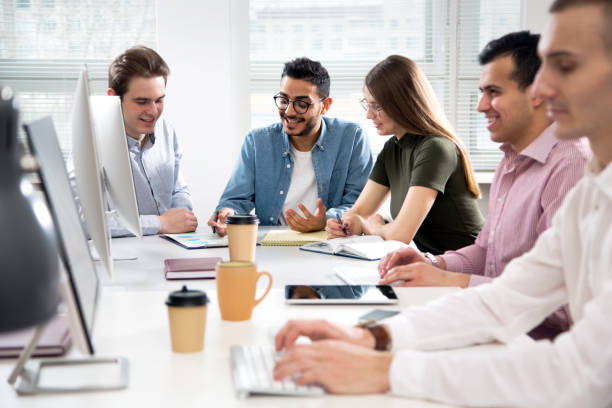 istock Multy-ethnic group of business people working at office 1276635173