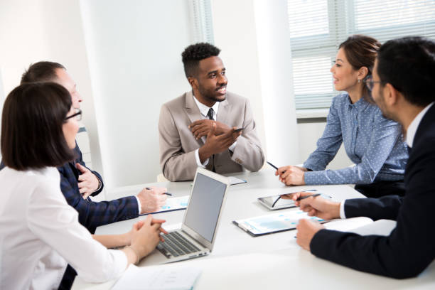 istock Multy-ethnic group of young business people working with computer at office 1276635186
