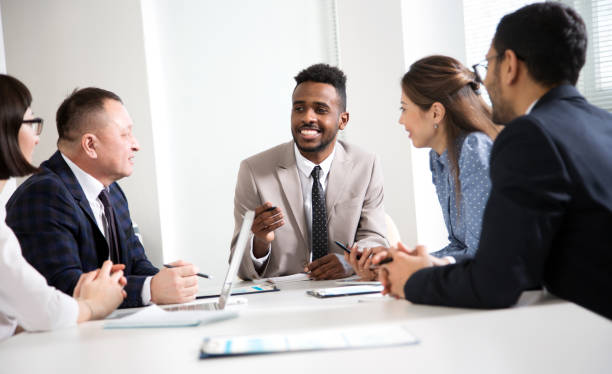 istock Multy-ethnic group of business people working at office 1276636006