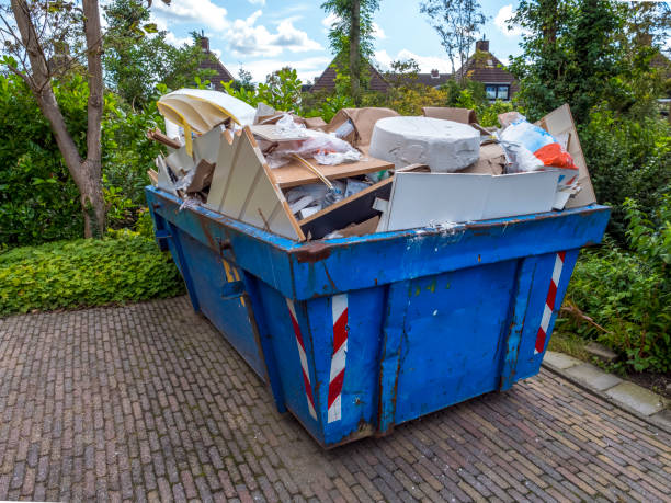 istock Overflowing industrial bin filled with construction scraps 1276636510