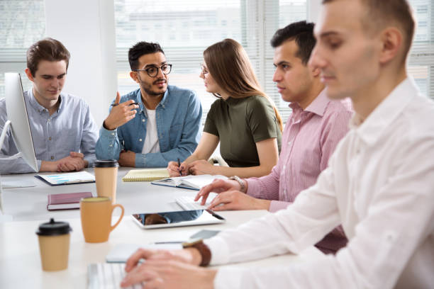 istock Multy-ethnic group of business people working at office 1276636557