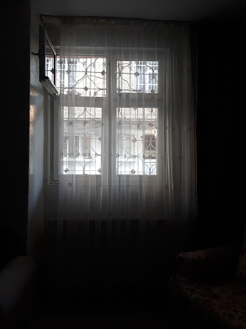 Black Room, Light Window, and Woman