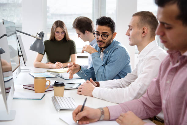 istock Multy-ethnic group of creative business people working with computer at office 1276637299