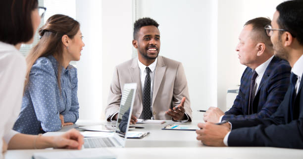 istock Multy-ethnic group of business people working at office 1276637538