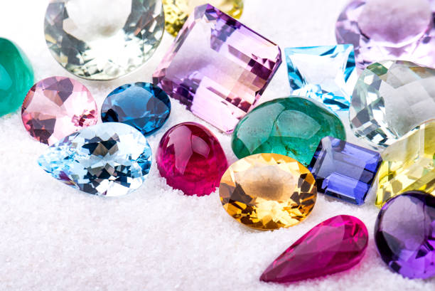 istock Group of gemstones on white sand. 1276638334