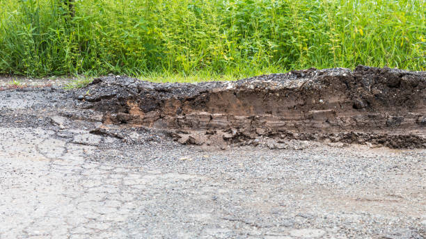 istock Asphalt road collapses from truck wheels. 1276639685
