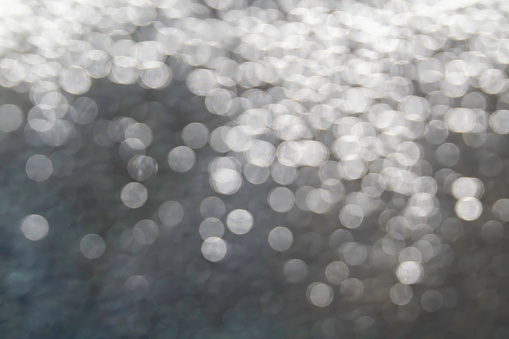 Soft Rounds Bokah, Blur light. Silver and white bokeh lights defocused. Abstract light bubble bokah on the metal. Light night bokeh city blur. Abstract background.