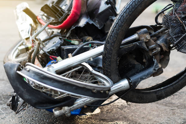 Close-up of a distorted motorcycle wheel. Close-up of the front of the motorcycle destroyed the distorted wheel of a serious accident until the driver died. used motorcycle parts stock pictures, royalty-free photos & images