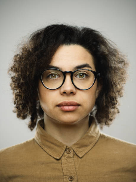 istock Studio portrait of young woman with blank expression 1276642404