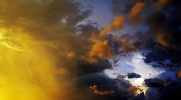 istock Amazing cloudscape on the sky at sunset time after rain. Dark clouds after rain at sunset time. 1276642567