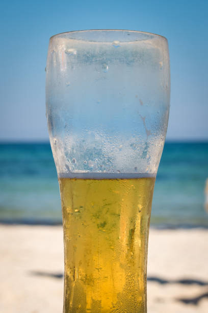 istock Cold beer on the beach and hot summer day. 1276642574