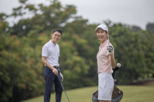 istock Asia Chinese man playing golf tee off while his partner watching. 1276652237