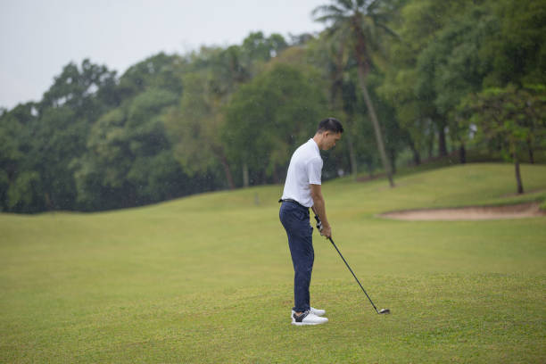 istock Asia Chinese man playing golf tee off on the golf course. 1276652269