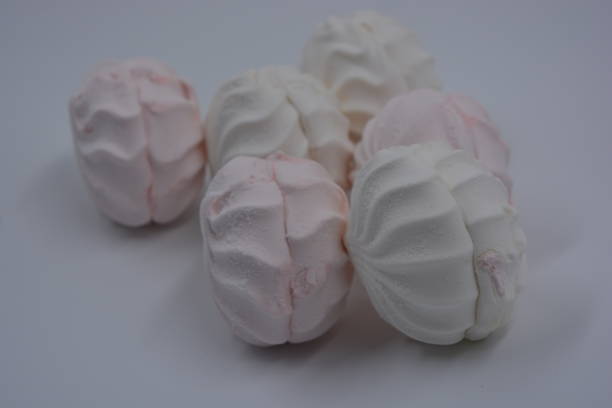 istock Airy, light and dietary Ukrainian sweets white and pink applesauce marshmallow beautifully arranged on a white matte background. 1276653821