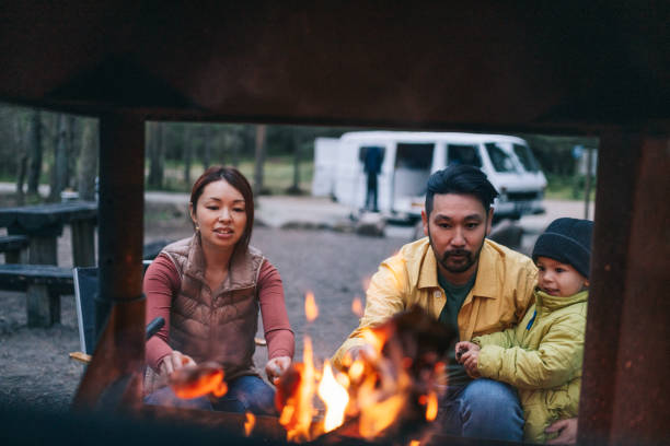 istock Happy family cooking on bonfire 1276654004