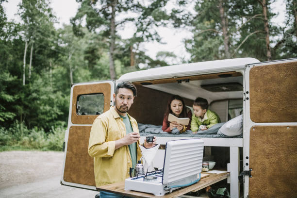 istock Man making coffee on camping stove 1276654059