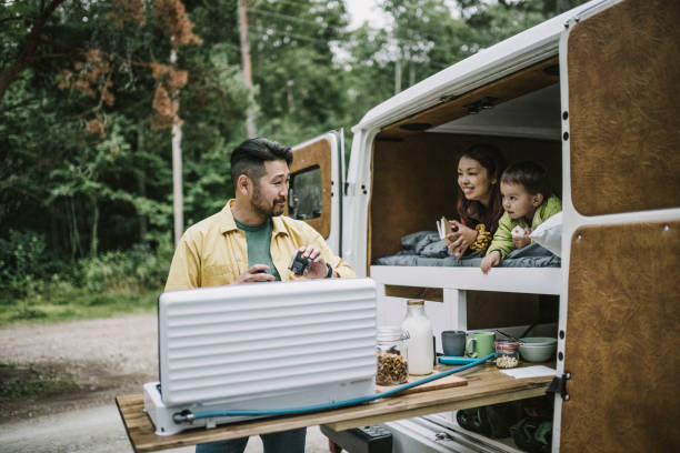 Man making coffee on camping stove