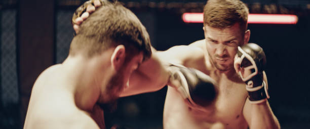 istock MMA fighters training. Eye contact and punches. Close up on face 1276655153