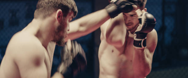 istock MMA fighters training. Eye contact and punches. Close up on face 1276655165