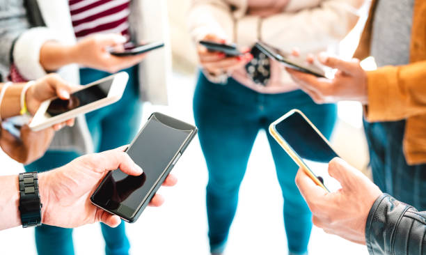 istock Friends group sharing content on mobile smart phone - Close up of people hands using tracking app with social media network - Technology concept with always connected millenials - Vivid bright filter 1276657698