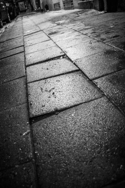 istock Pavement of the sideway on a rainy evening, Brussels, Belgium 1276657903