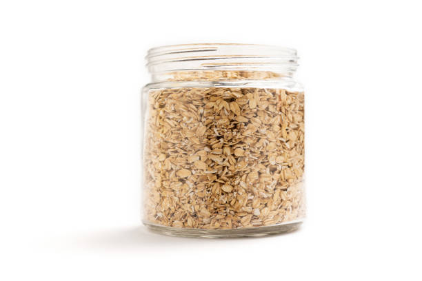istock A jar of oat flakes isolated on white background 1276658603