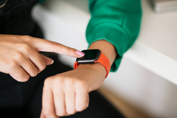 istock Young Caucasian woman using her smart watch, close-ups 1276658911
